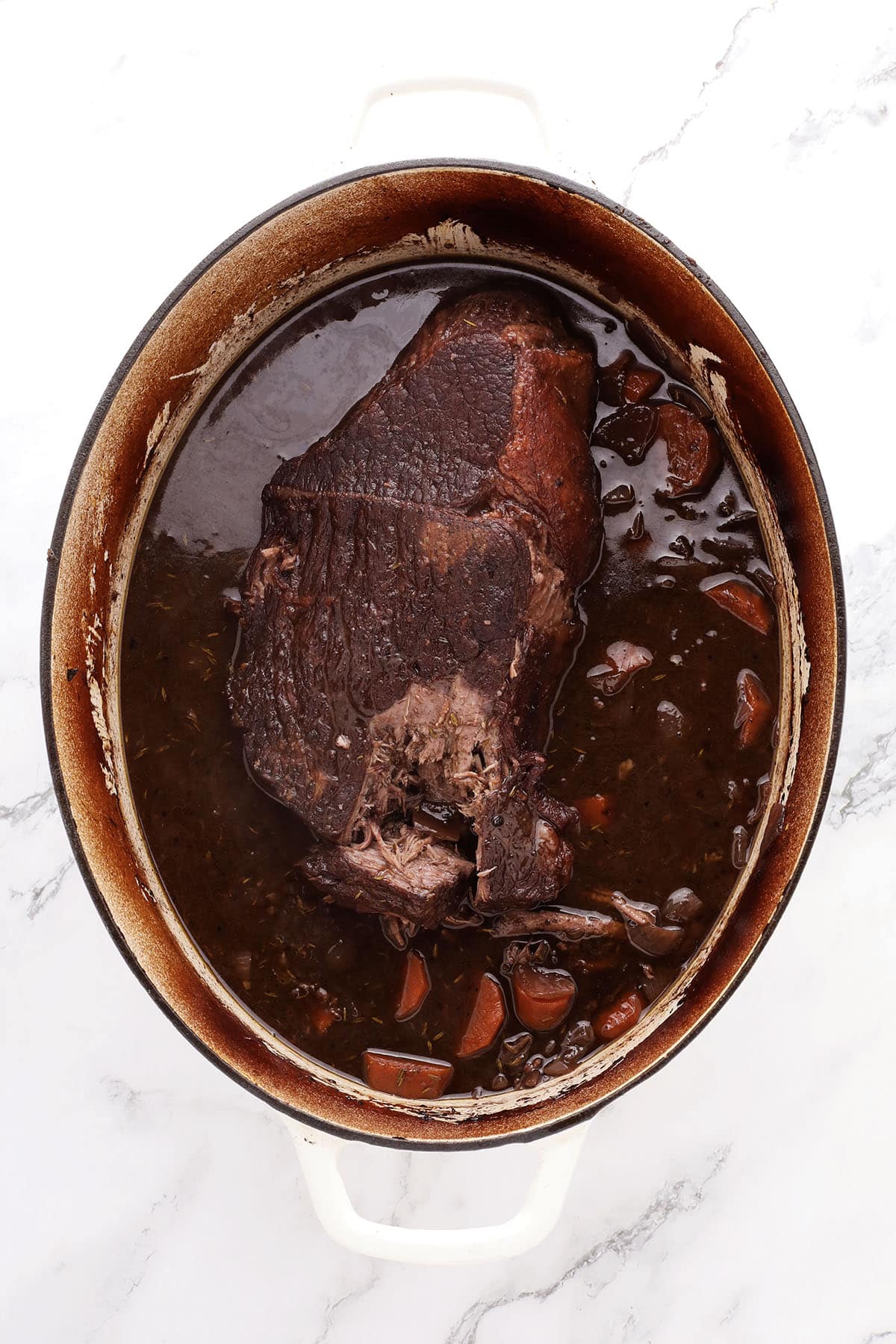 Tender chuck roast with red wine sauce and carrots