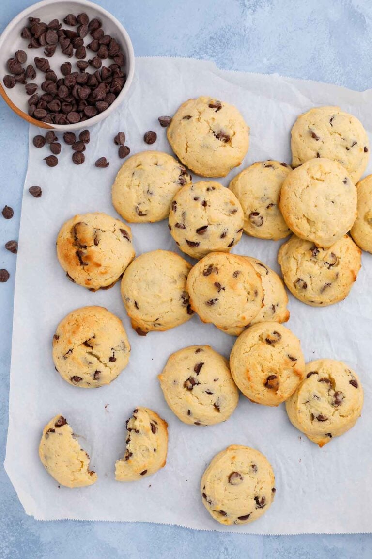stacks of soft applesauce chocolate chip cookies on parchment paper