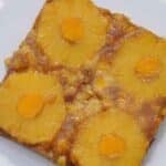 pineapple mango upside down cake on a white plate