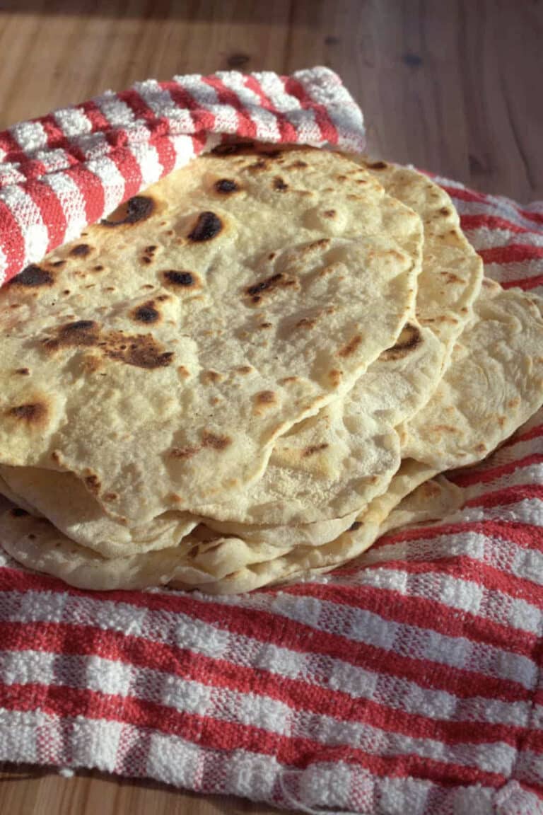 fresh homemade flour tortillas on a towel