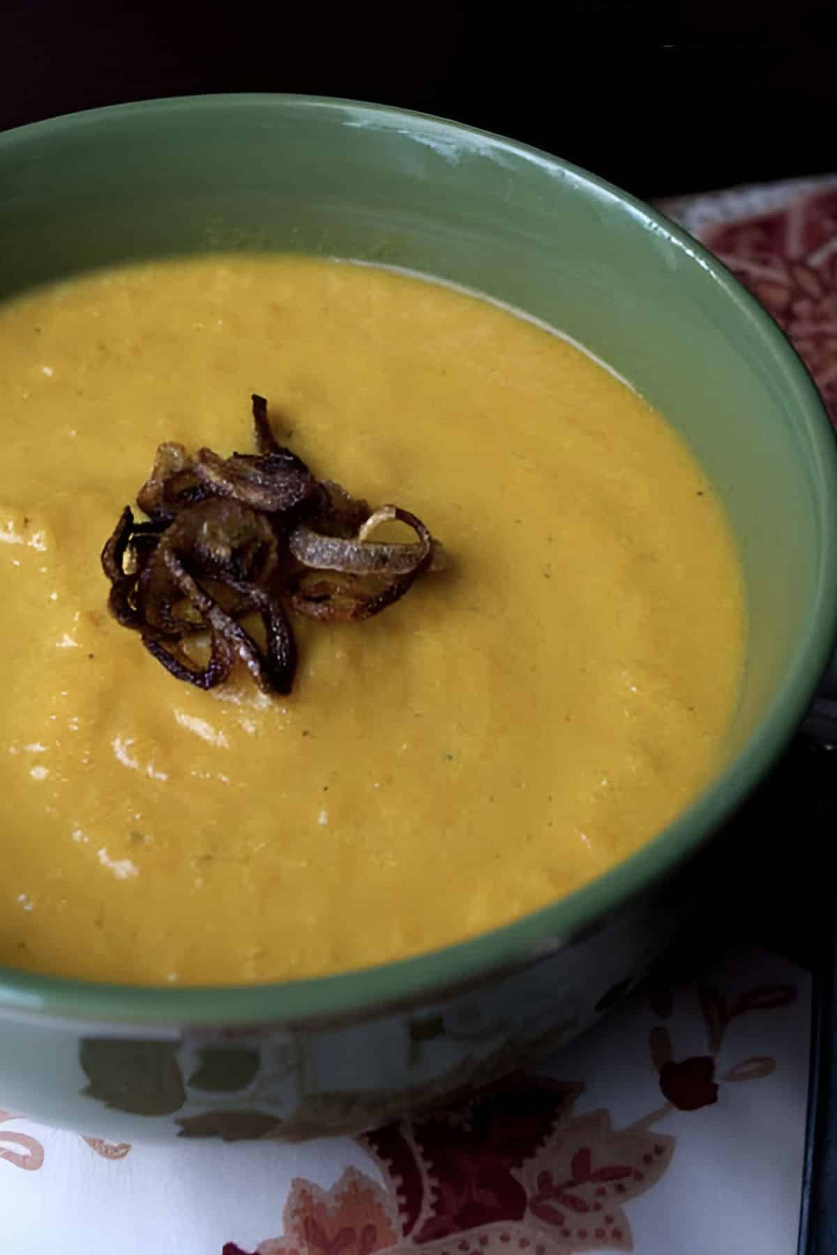 Close-up of soup garnished with fried shallots