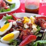 strawberry salad with bacon, bleu cheese and egg.