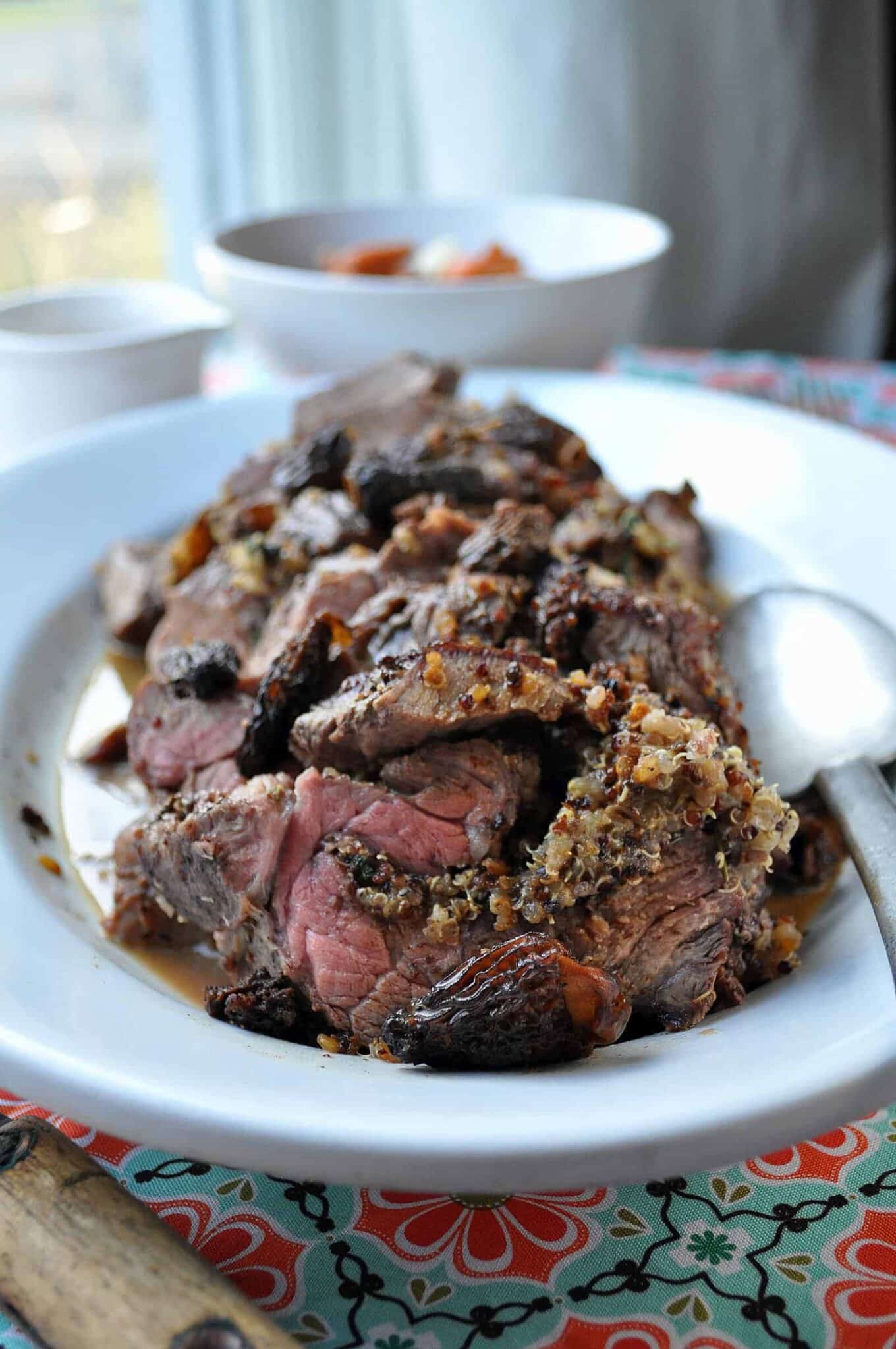 beef roulade stuffed with morels and quinoa on a plate