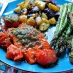 salmon with herbed butter and burst tomato sauce