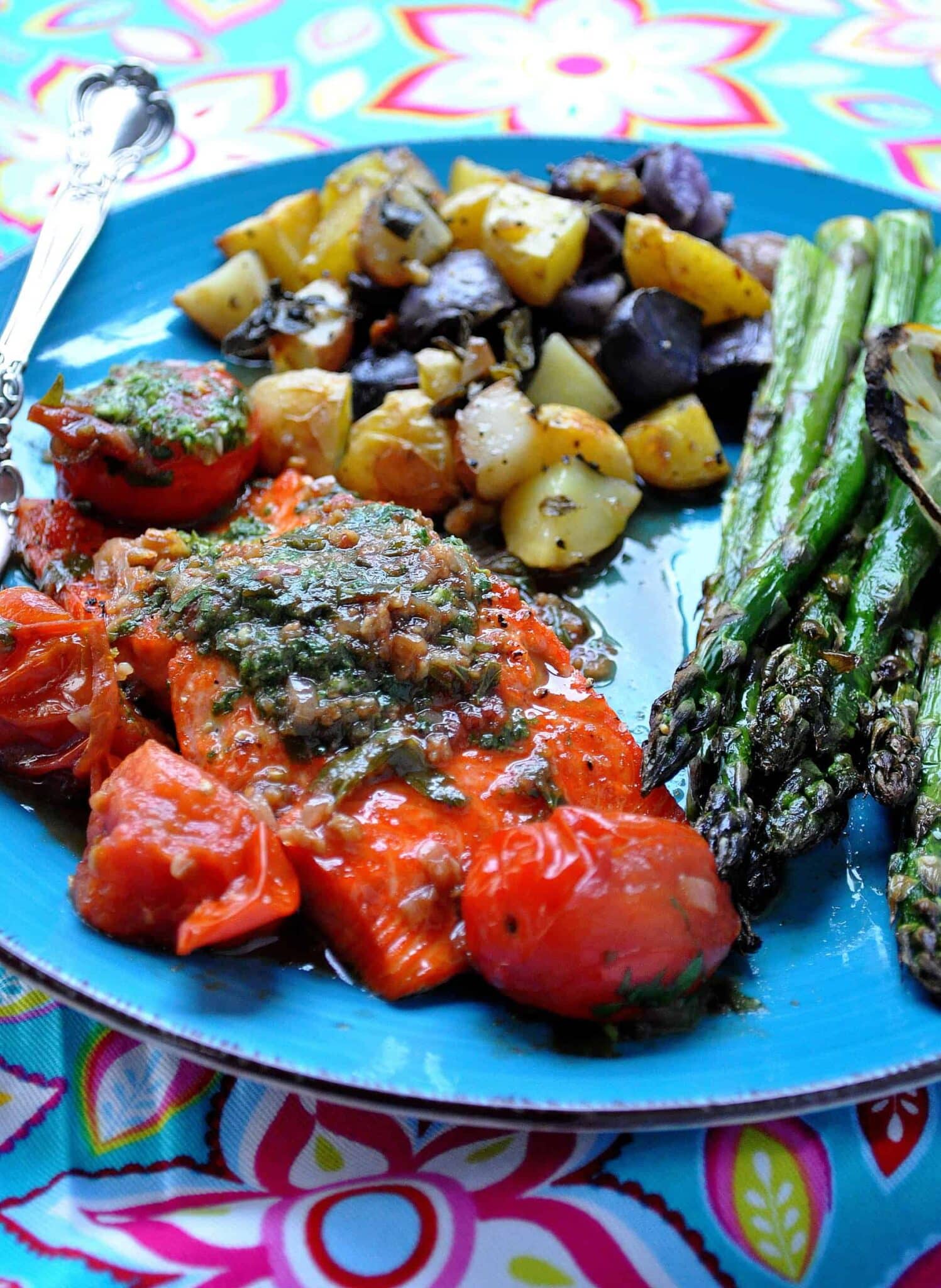 salmon with herbed butter and burst tomato sauce