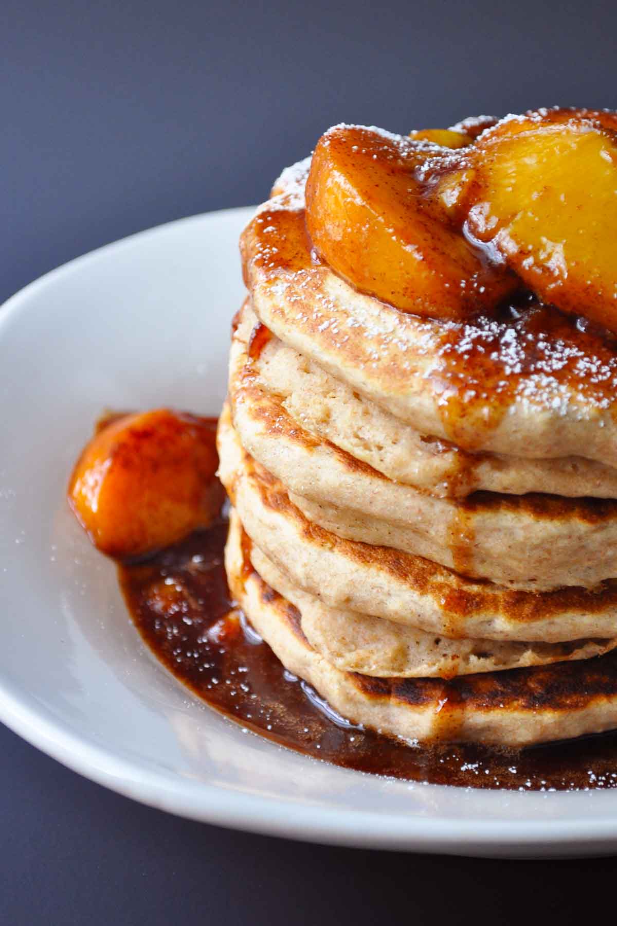 peach pancakes close up on a white plate