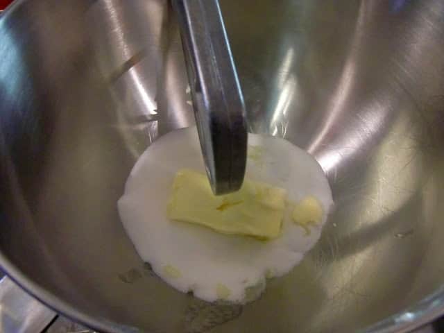 butter and sugar being creamed in a bowl