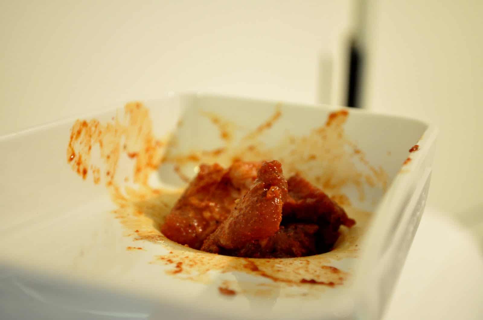 grind cubed seasoned meat to make homemade linguica from scratch