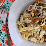 herbed pasta with pears and blue cheese in a bowl