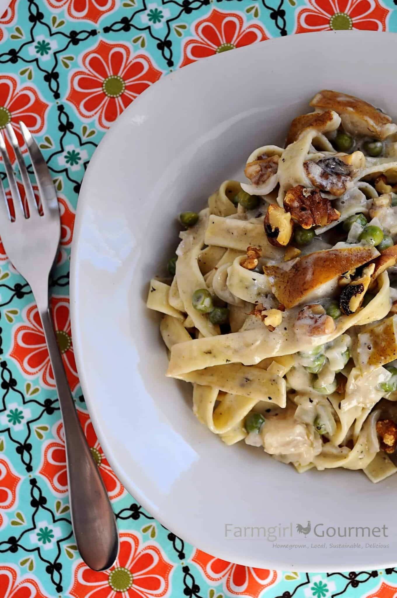 herbed pasta with pears and blue cheese in a bowl