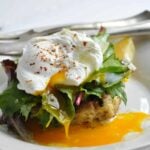 clam cakes with greens & poached egg