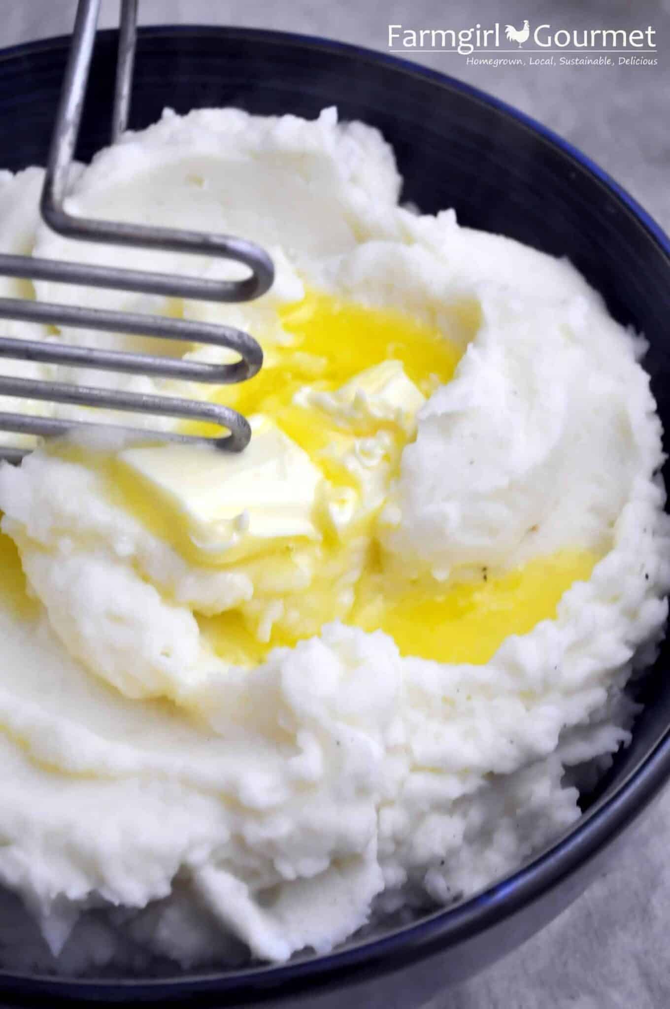 Super Creamy Mashed Potatoes 2 close-up of super creamy mashed potatoes with butter in a bowl