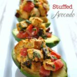 close up of blt stuffed avocados on a plate