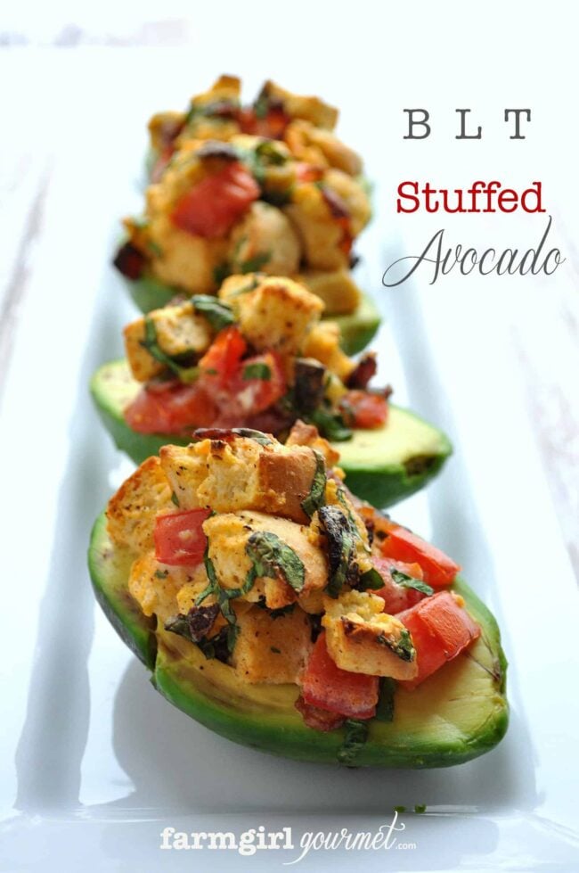 close up of blt stuffed avocados on a plate
