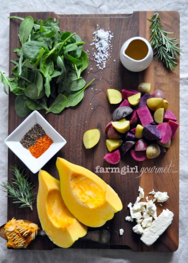 warm potato salad ingredients on a board