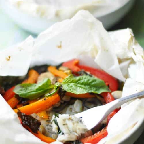 a close up of cod pockets cooked en papillote
