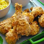 Family-style platter of oven-fried chicken made with potato chips