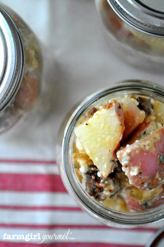 warm potato salad with cotija served in a mason jar