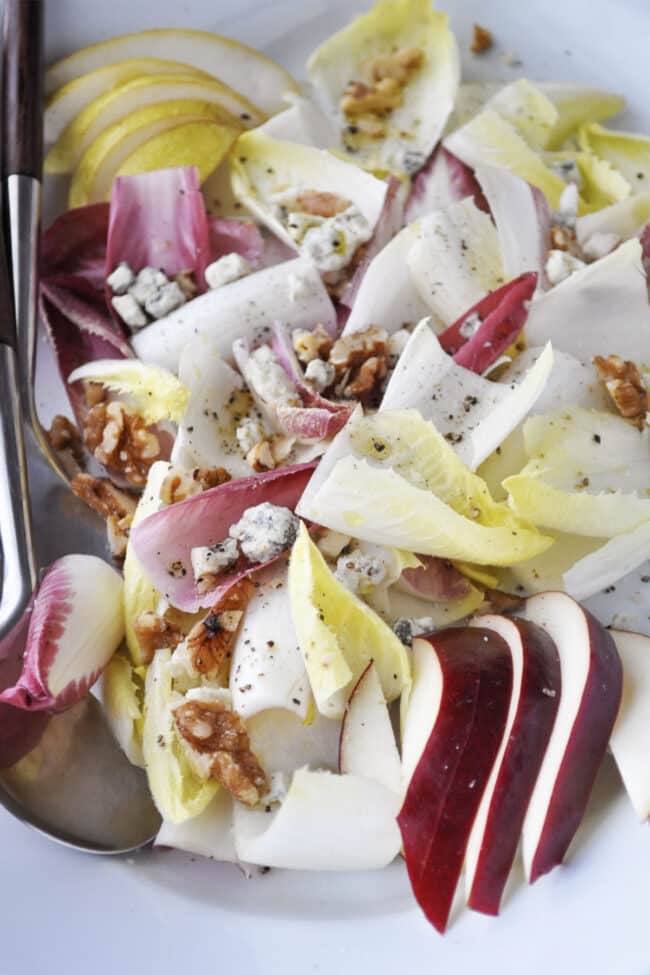 endive salad with pears and blue cheese on a platter
