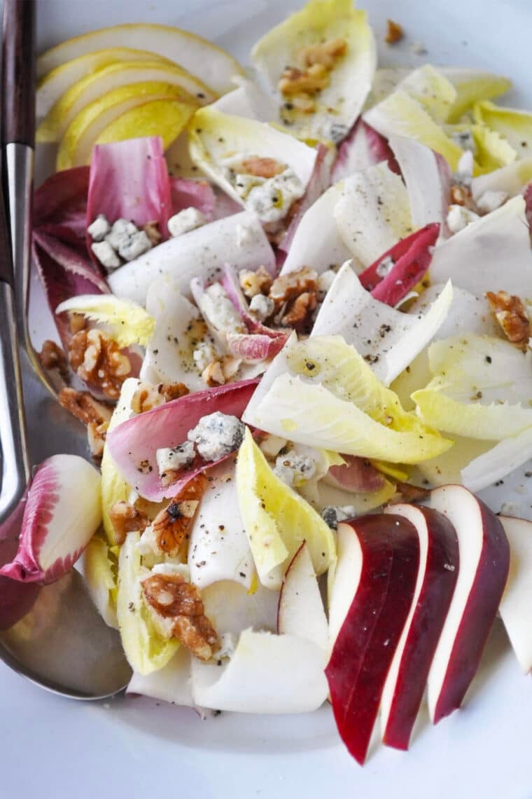 endive salad with pears and blue cheese on a platter