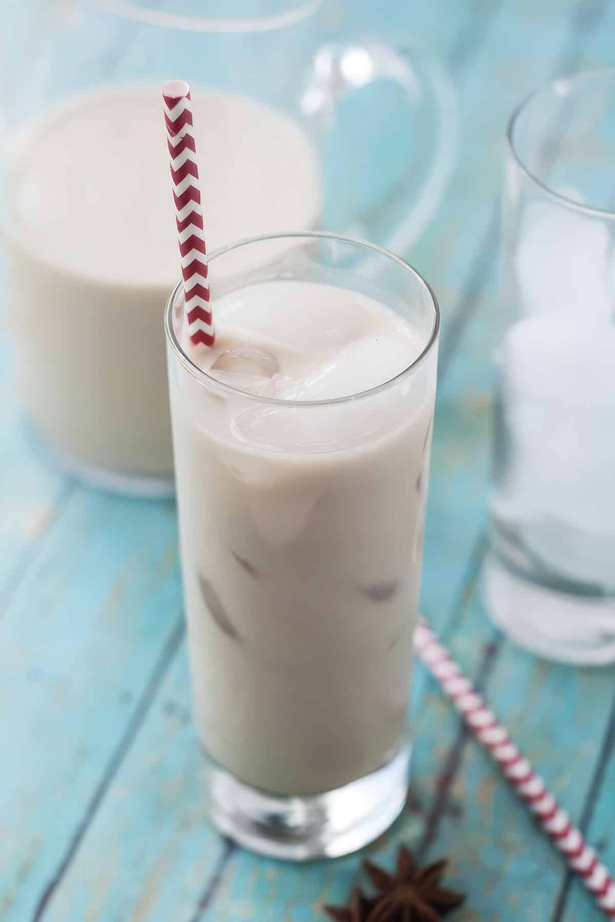 Close-up of creamy Cashew Horchata on blue wood background