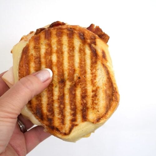closeup of a turkey bacon and hummus panini