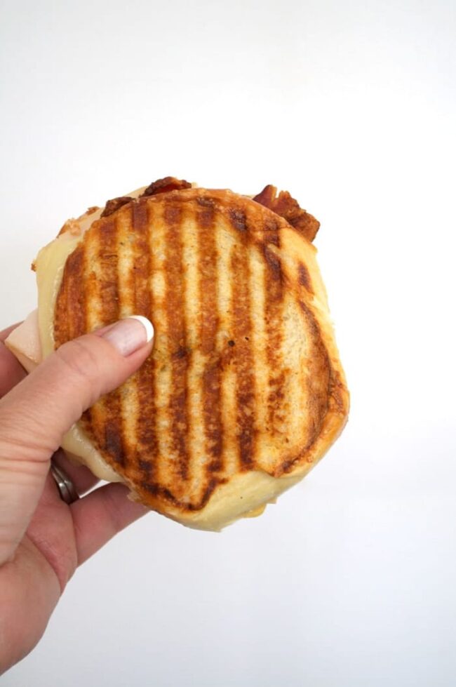 closeup of a turkey bacon and hummus panini