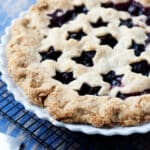 close-up of a cherry pie with star lattice top