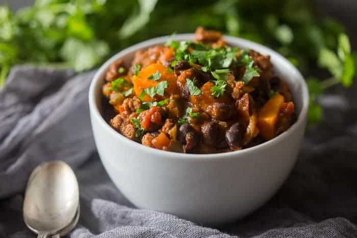 This spicy chorizo sweet potato black bean chili is ready in just 30 minutes and is packed full of hearty deliciousness. Top with cilantro and call it dinner!