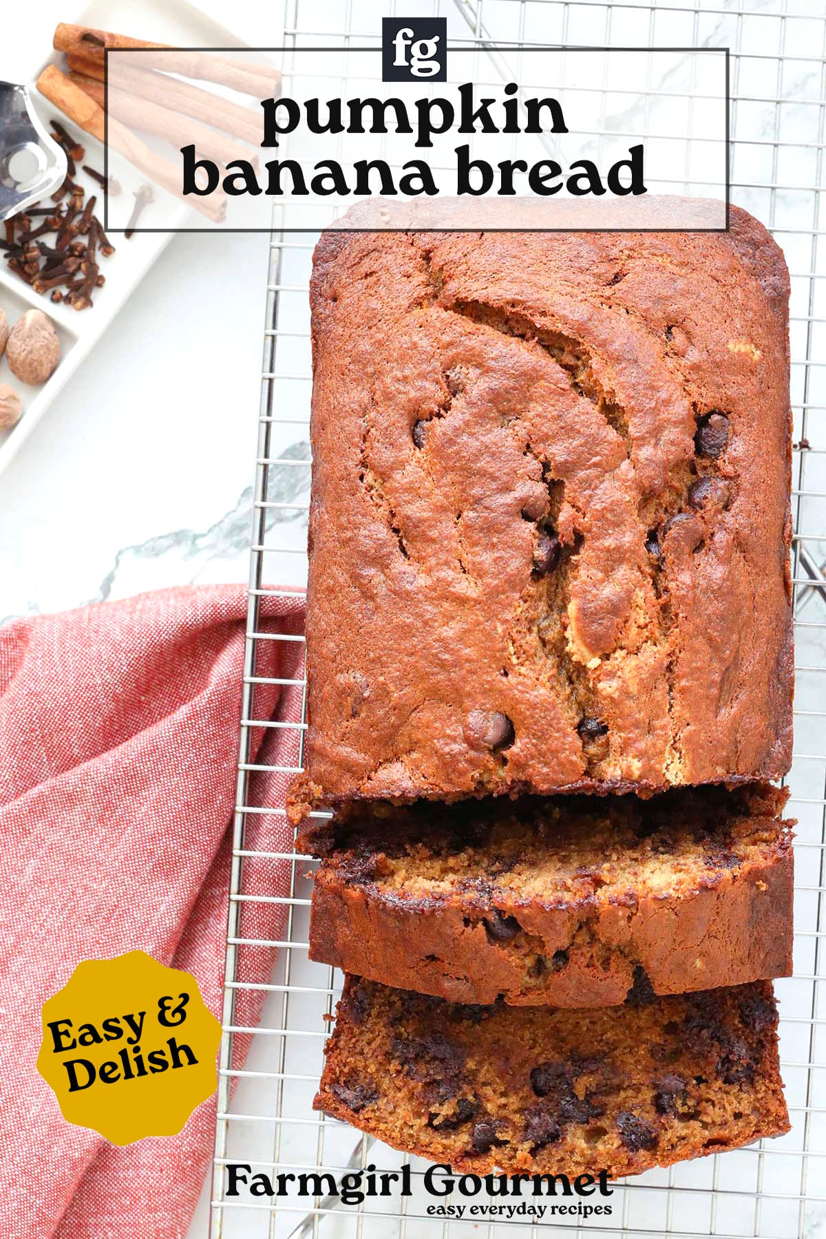 A loaf of banana pumpkin bread with chocolate chips sits on a cooling rack, with two slices cut. A red cloth, spices, and the text pumpkin banana bread and Easy & Delish appear on the image.