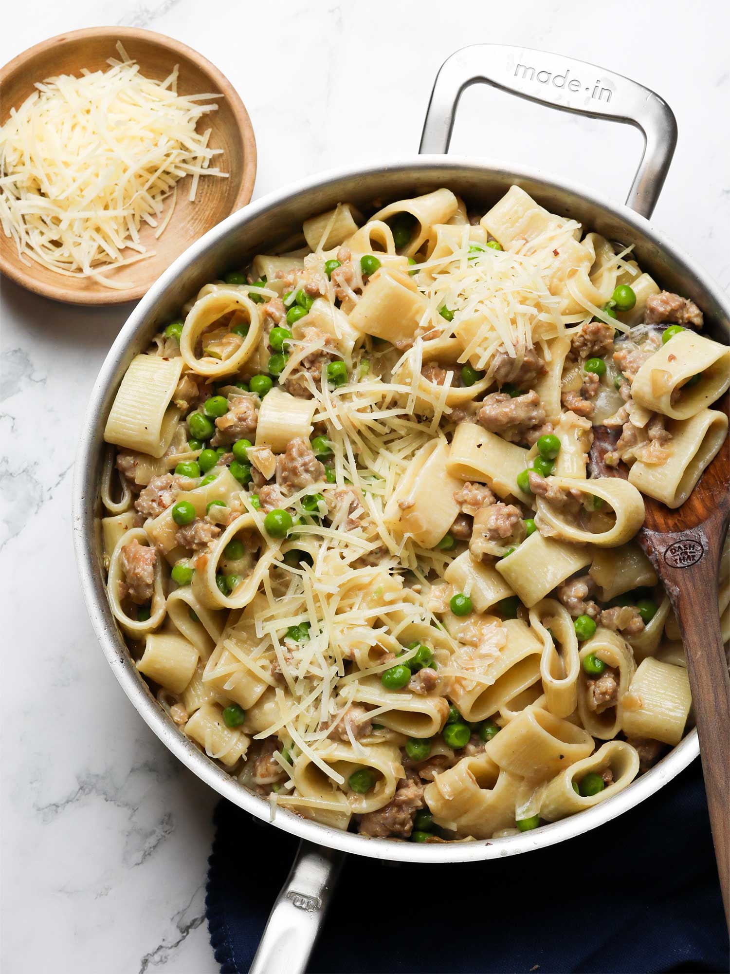 creamy sausage and pea pasta recipe with caramelized onions