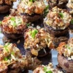 spicy italian sausage, mozzarella cheese, and panko bread crumbs make these Spicy Sausage Stuffed Mushrooms so delicious.