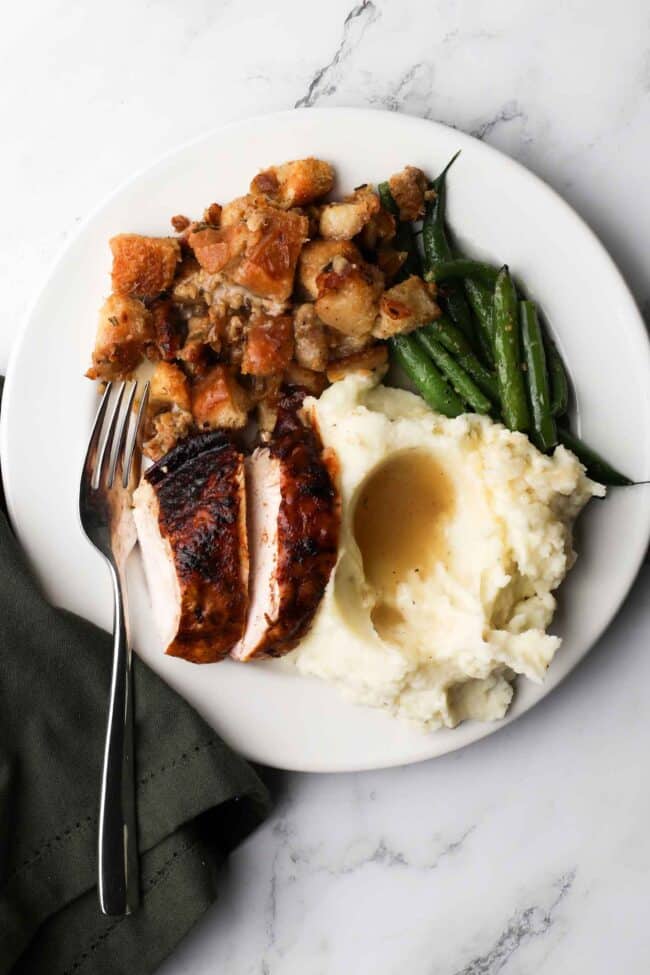 spatchcocked turkey with mashed potatoes and green beans