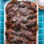 top down view of chocolate gingerbread croissant bake in a white dish