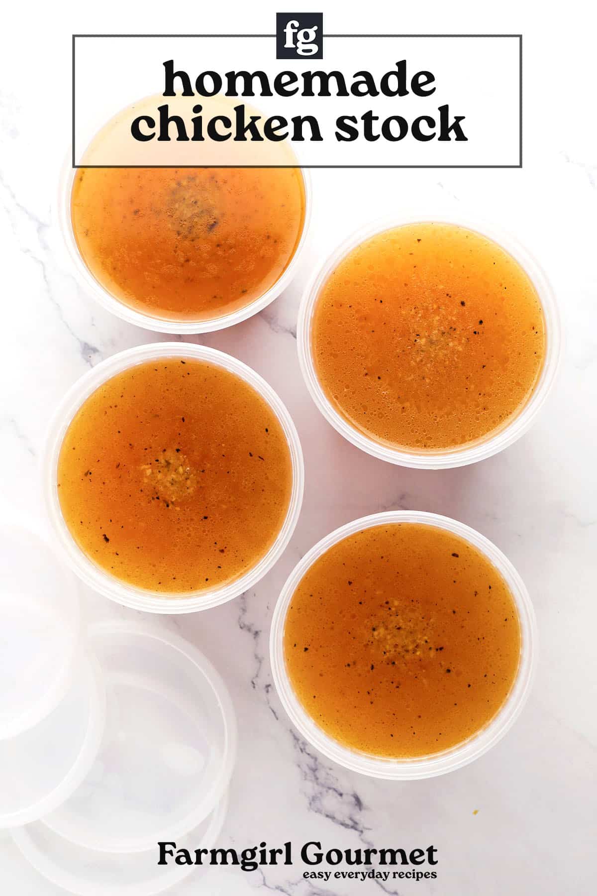 Four round plastic containers filled with a basic chicken stock recipe sit on a white marble surface. The golden-brown stock has specks of seasoning. The text reads, “homemade chicken stock” and “Farmgirl Gourmet.”.