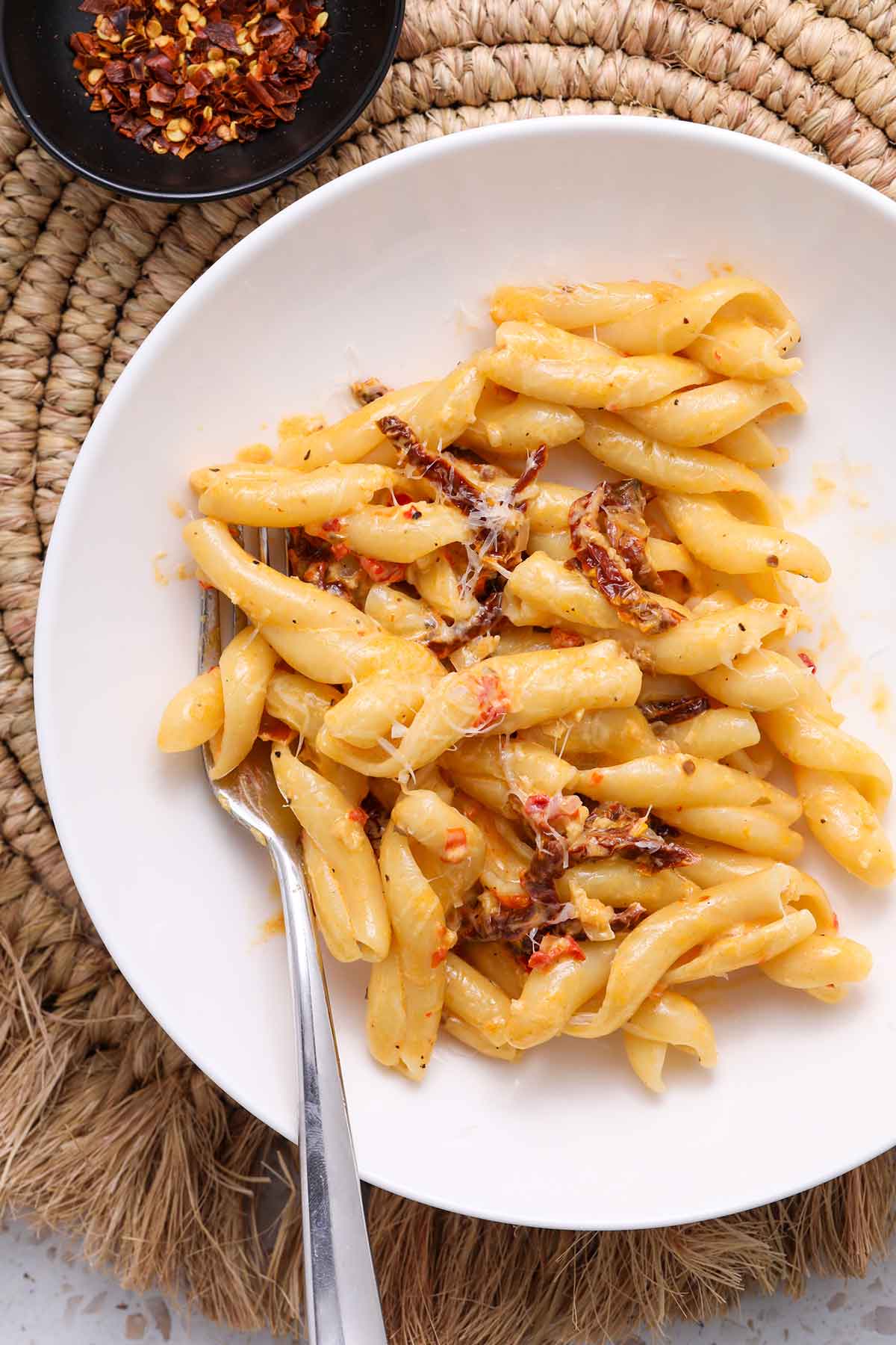 Bowl of creamy Calabrian chile pasta with sundried tomatoes