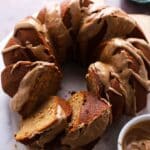 Sliced Pumpkin Spice Bundt Cake showing tender crumb and drizzle of icing