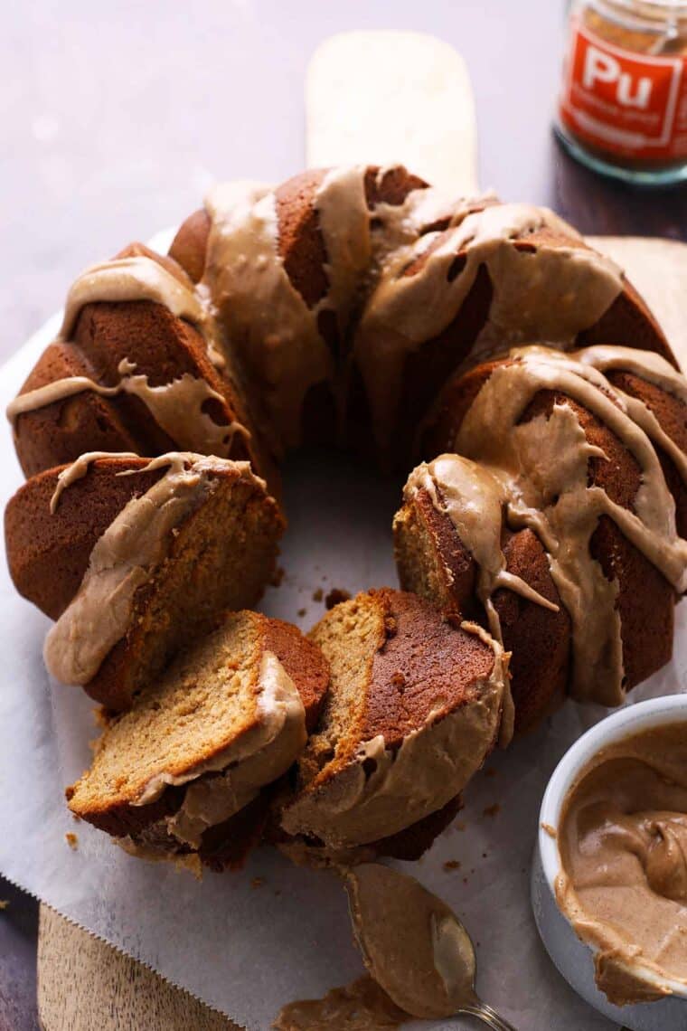 Sliced Pumpkin Spice Bundt Cake showing tender crumb and drizzle of icing