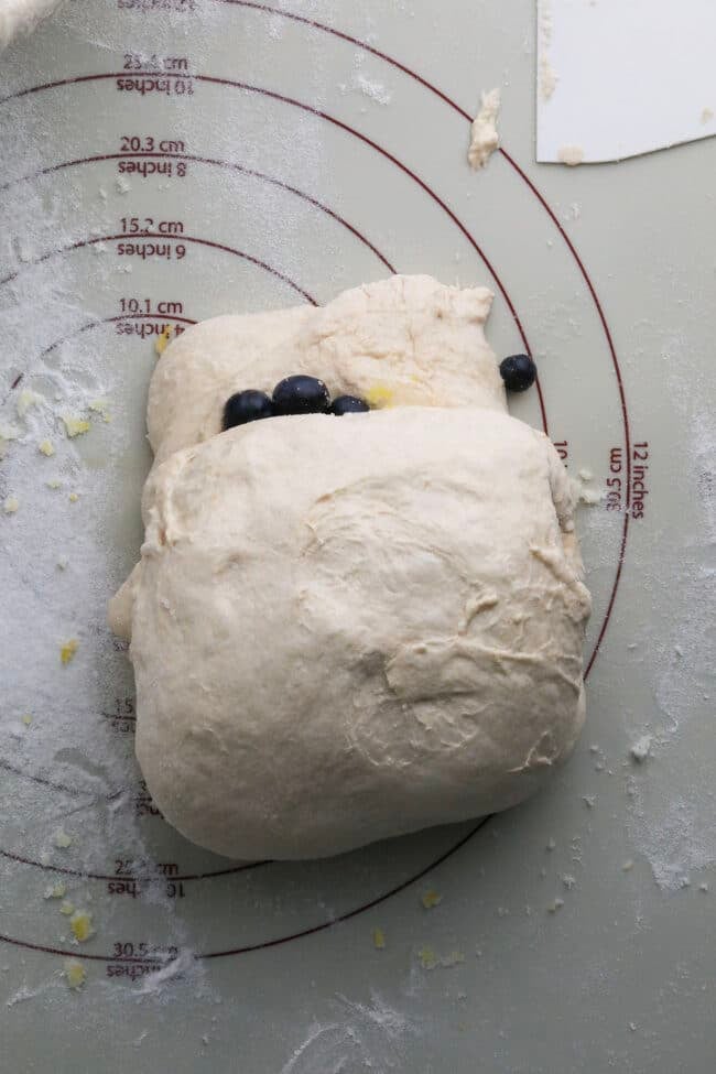 fresh blueberry bread dough rolled up