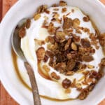 Carrot cake granola on yogurt in a bowl