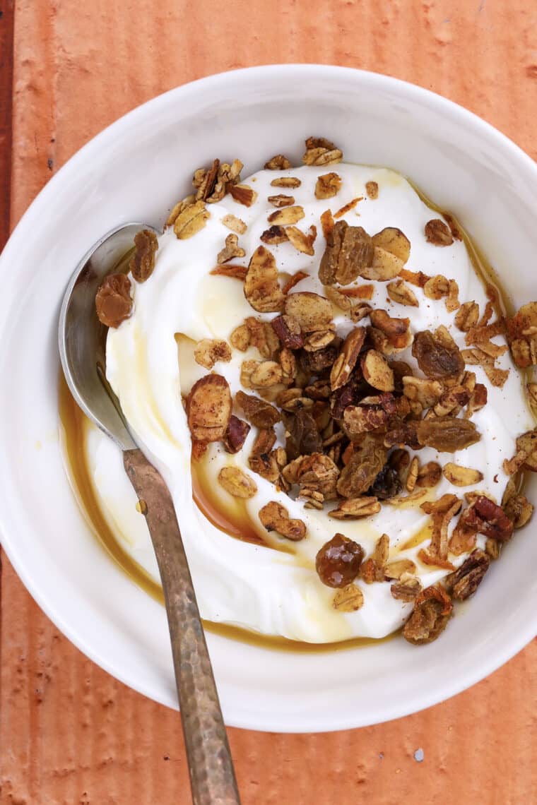 Carrot cake granola on yogurt in a bowl