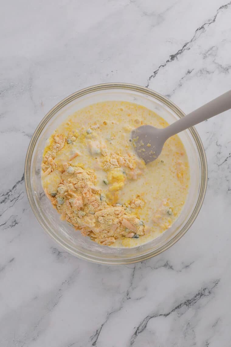 adding the wet ingredients to cheddar jalapeno cornbread mix