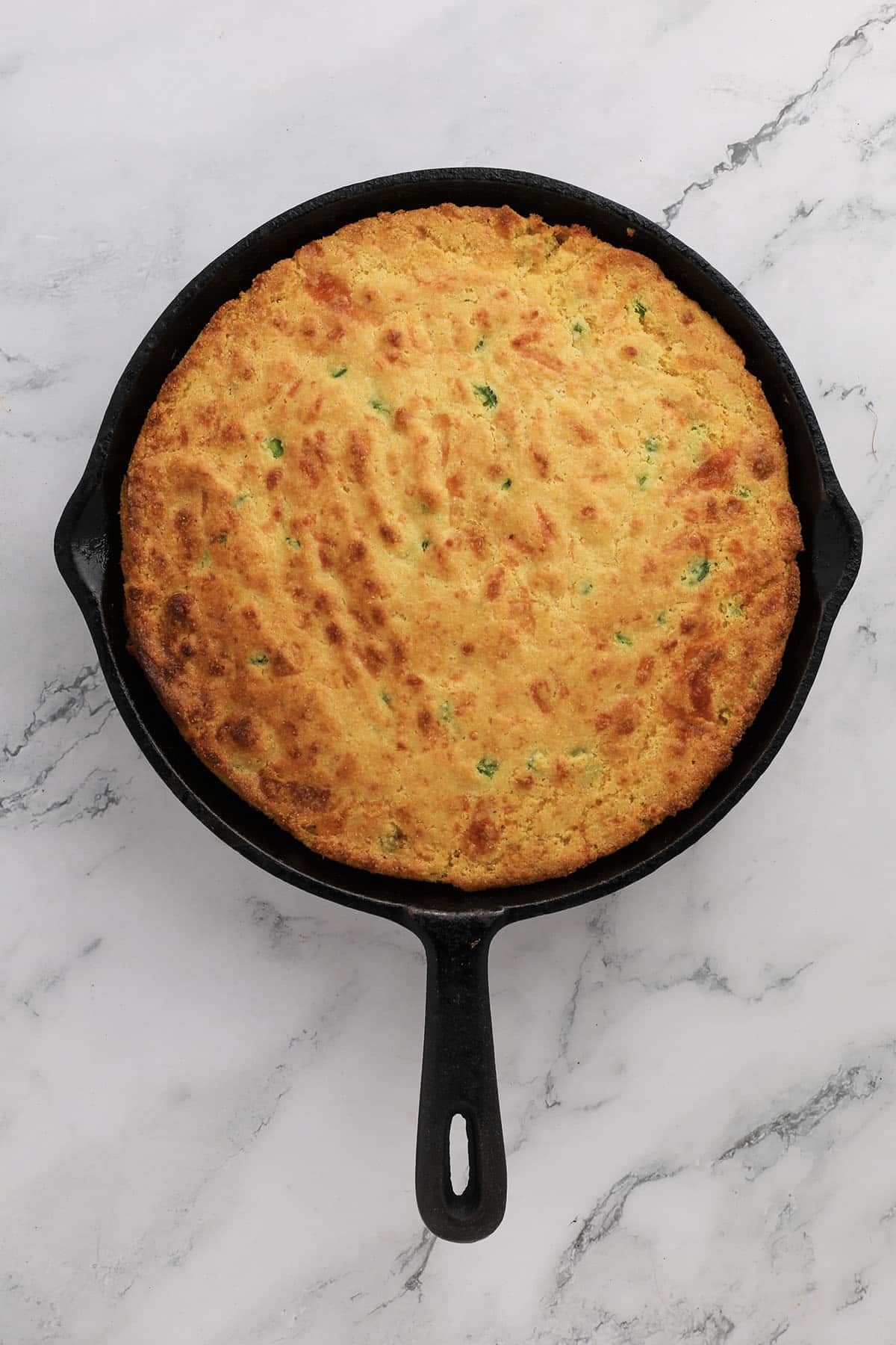 Jalapeno cornbread in a skillet right out of the oven