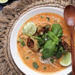 Bowl of Creamy Ginger Chicken Meatball Soup with noodles and cilantro
