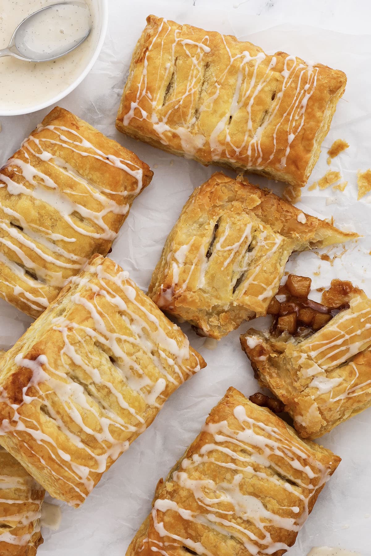 closeup of golden flaky apple turnovers lightly spiced with pumpkin pie spice