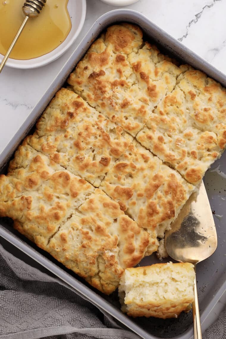 close-up of fluffy butter swim biscuits slided and ready for a drizzle of honey
