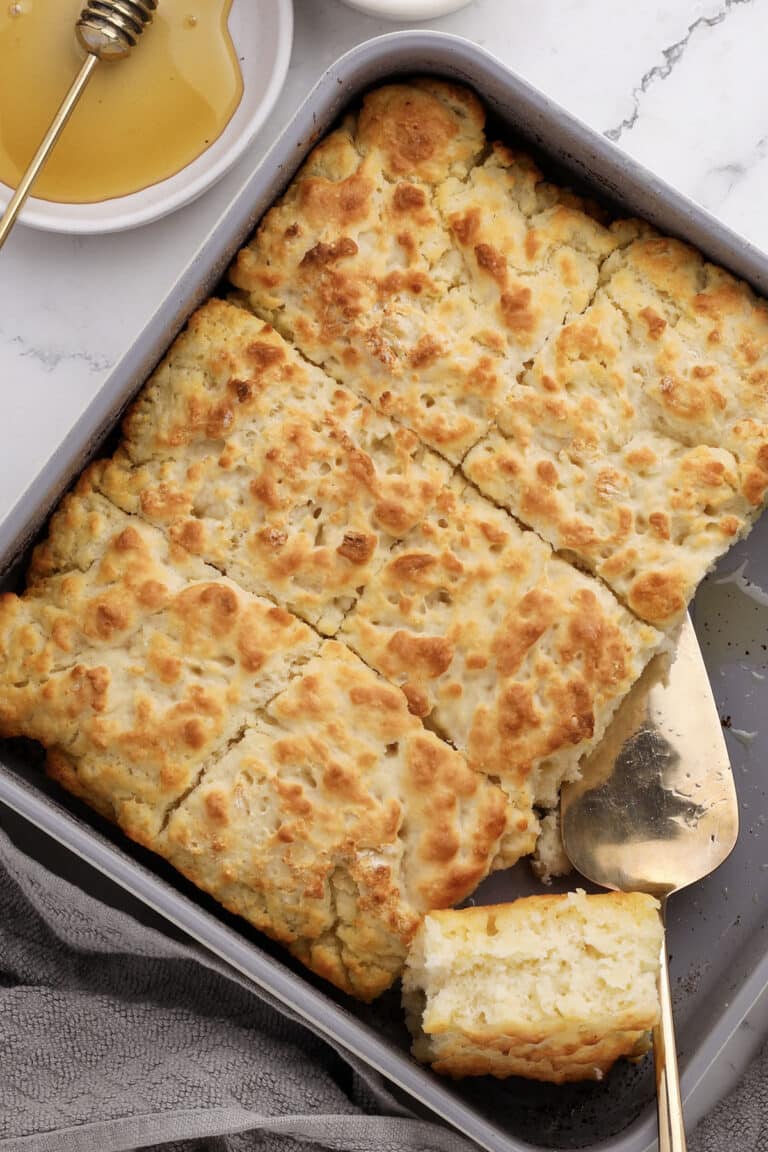 close-up of fluffy butter swim biscuits slided and ready for a drizzle of honey