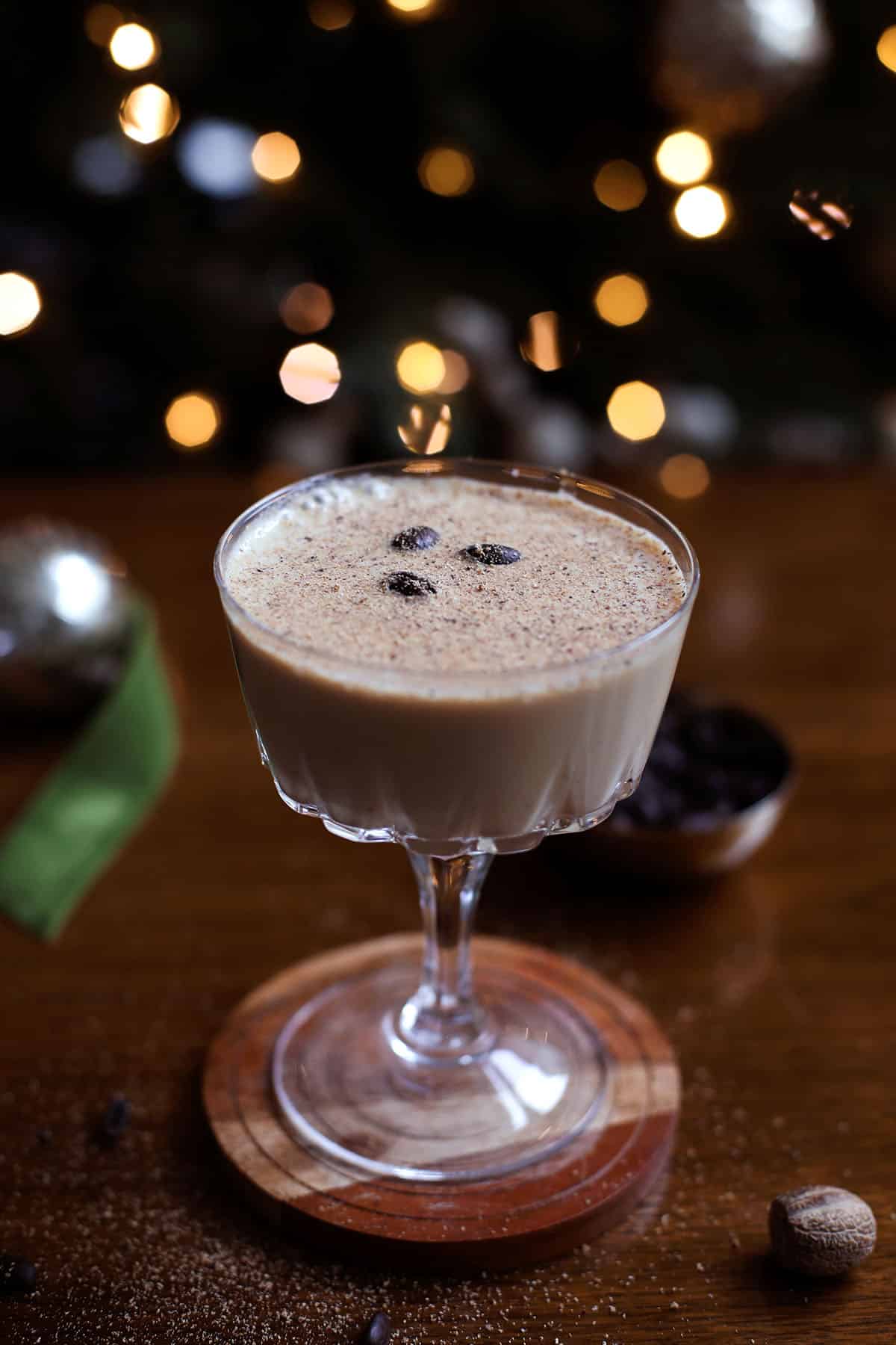Eggnog espresso martini in coupe glass with nutmeg garnish