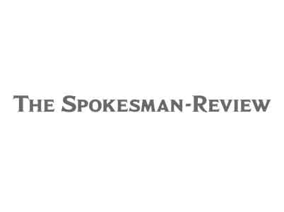 The Spokesman-Review logo features the newspaper name in gray, serif font on a plain white background, reflecting a classic design that says much about the publication’s enduring presence.