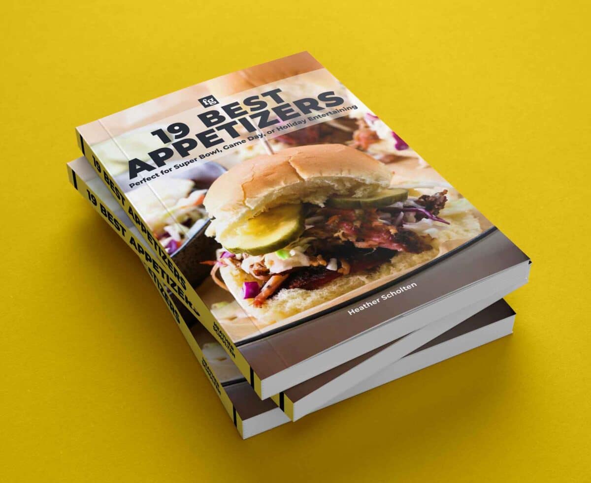 A stack of three books titled 19 Best Appetizers with a cover image of a loaded sandwich on a yellow background. The subtitle reads, Perfect for Super Bowl, Game Day, or Holiday Entertaining.